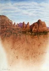 A painting of the desert with mountains in it