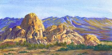A painting of mountains and rocks in the desert