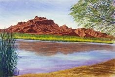A painting of the desert and water